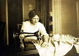 Woman sewing with Singer machine